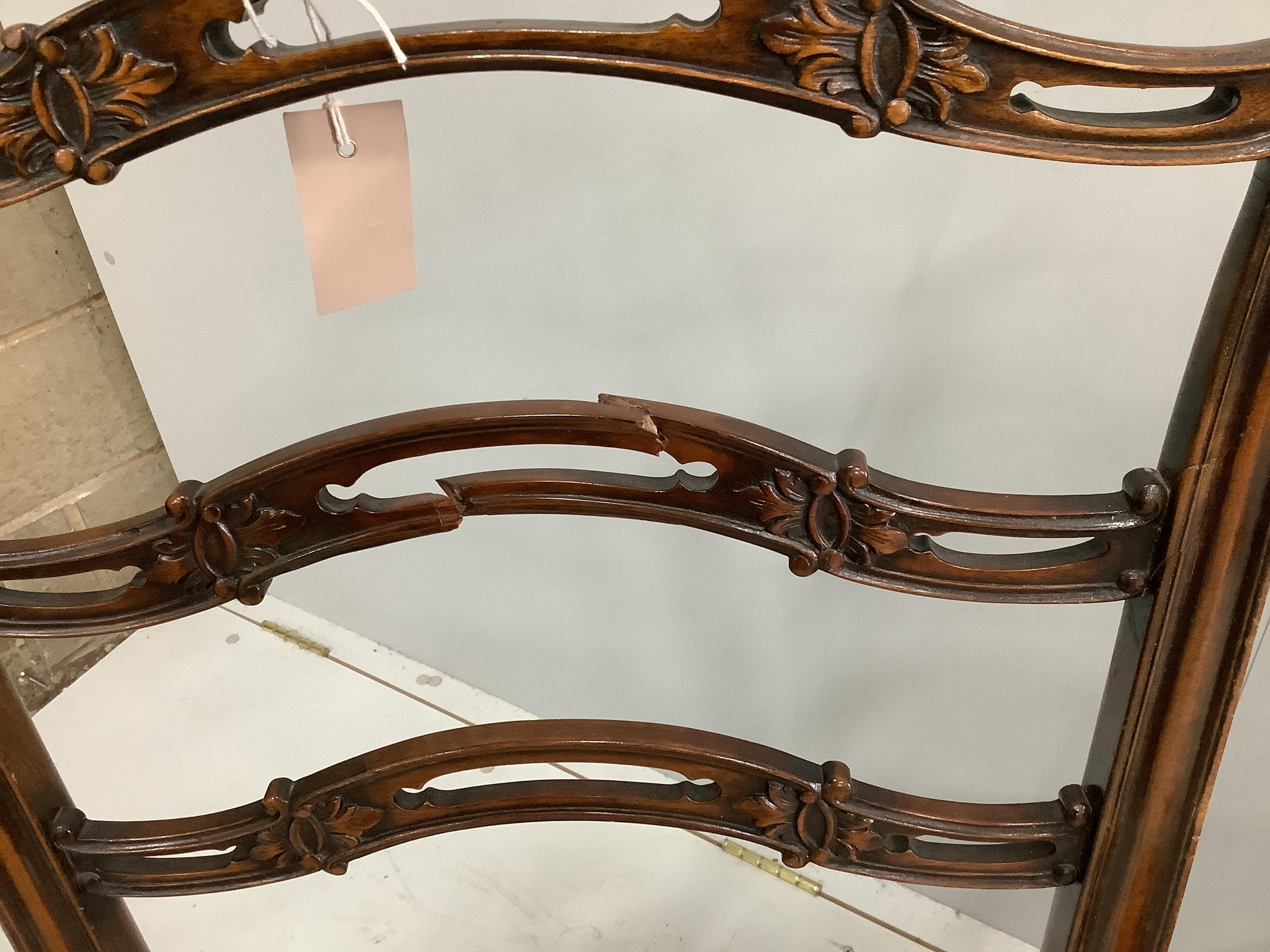 A set of four George III style mahogany pierced ladder back dining chairs (one a/f), width 54cm, depth 45cm, height 101cm